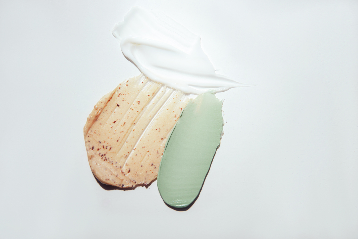 Multicolored samples of cosmetic products on a white background