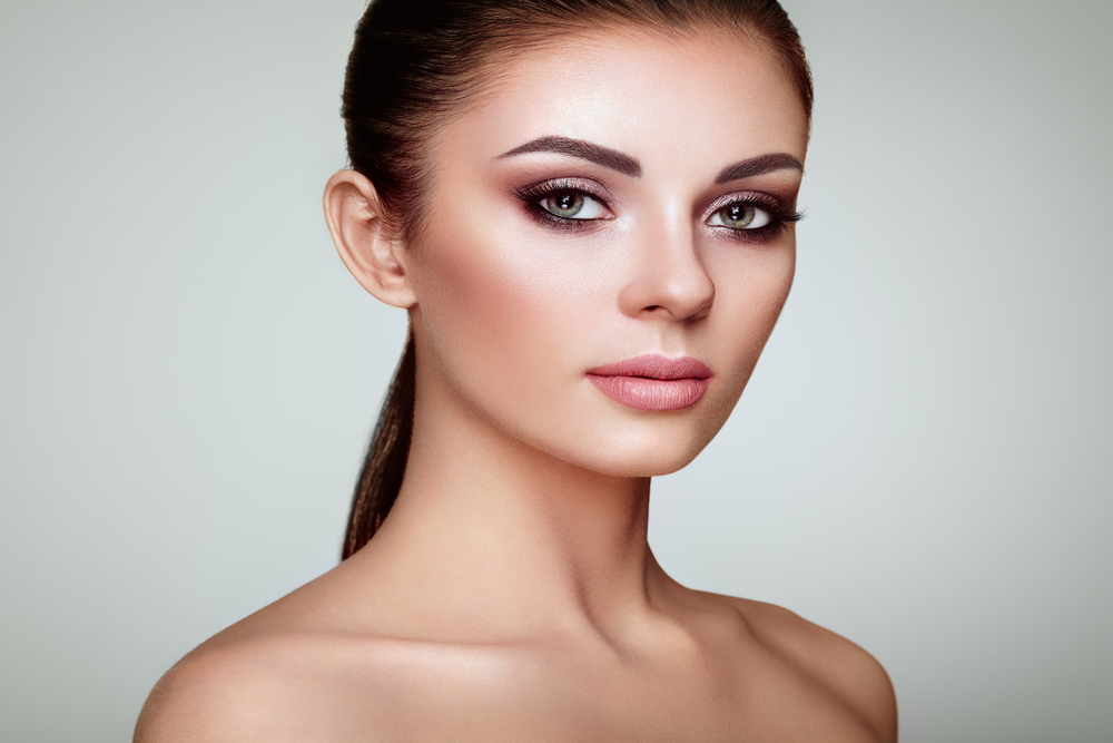 Brunette woman in early 30s has flawless skin thanks to IPL photofacial treatment