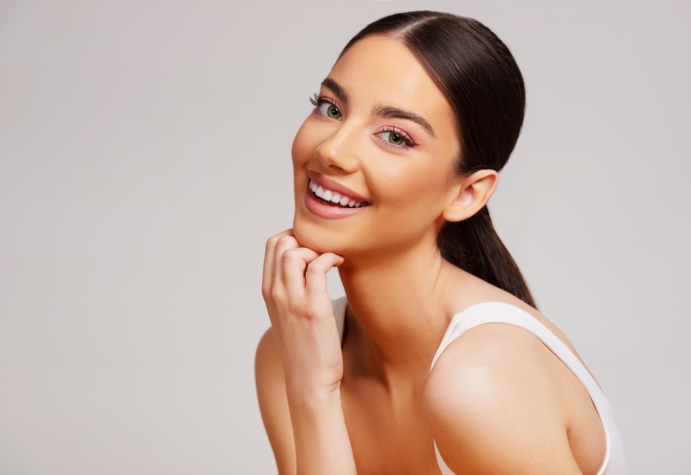 Pretty woman has glowing, hydrated skin after HydraFacial in Seattle.