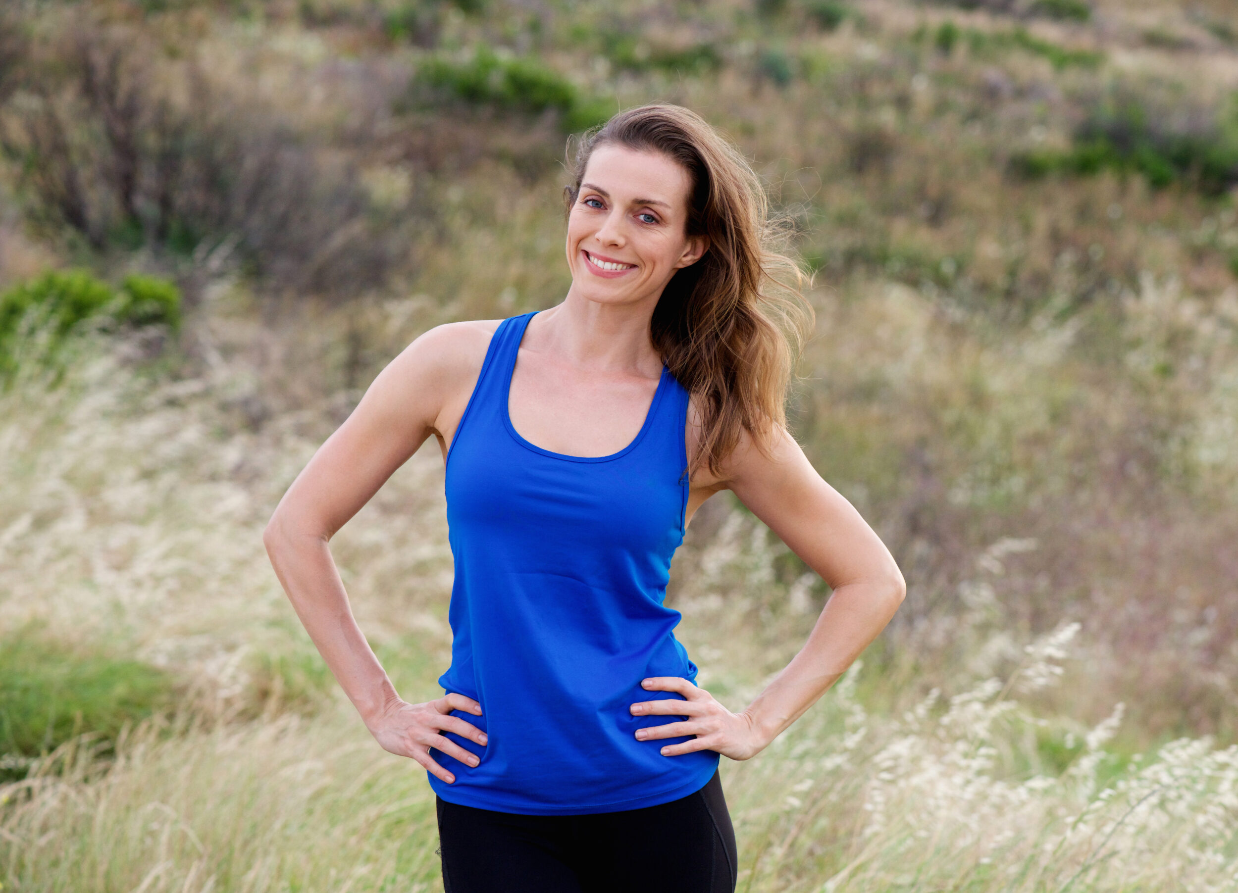 Woman in tank top is confident with her body after Morpheus8 treatments