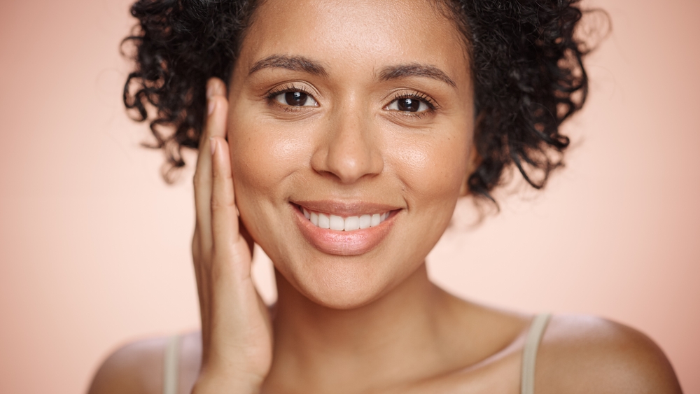 Beautiful mixed race woman has smooth under-eye area after cosmetic treatments.